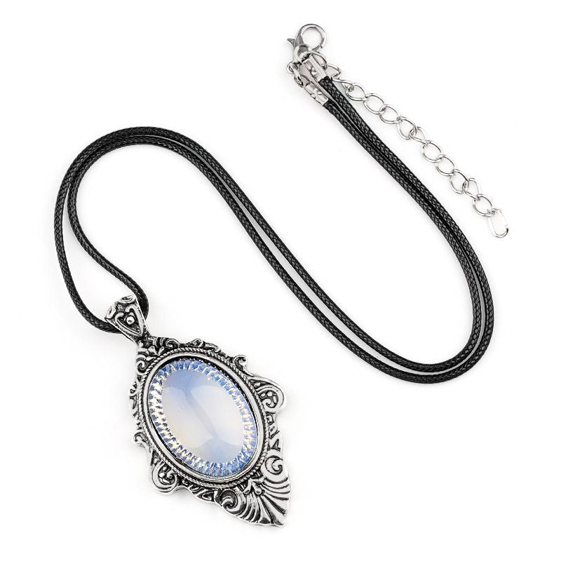 Pingente de pedra de olho de tigre natural, espelho mágico feminino estilo retro 31 * 46mm bainha pingente de cristal incrustado.
