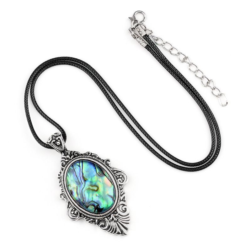 Pingente de pedra de olho de tigre natural, espelho mágico feminino estilo retro 31 * 46mm bainha pingente de cristal incrustado.