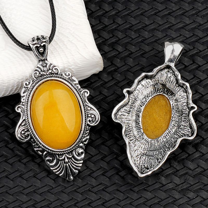 Pingente de pedra de olho de tigre natural, espelho mágico feminino estilo retro 31 * 46mm bainha pingente de cristal incrustado.